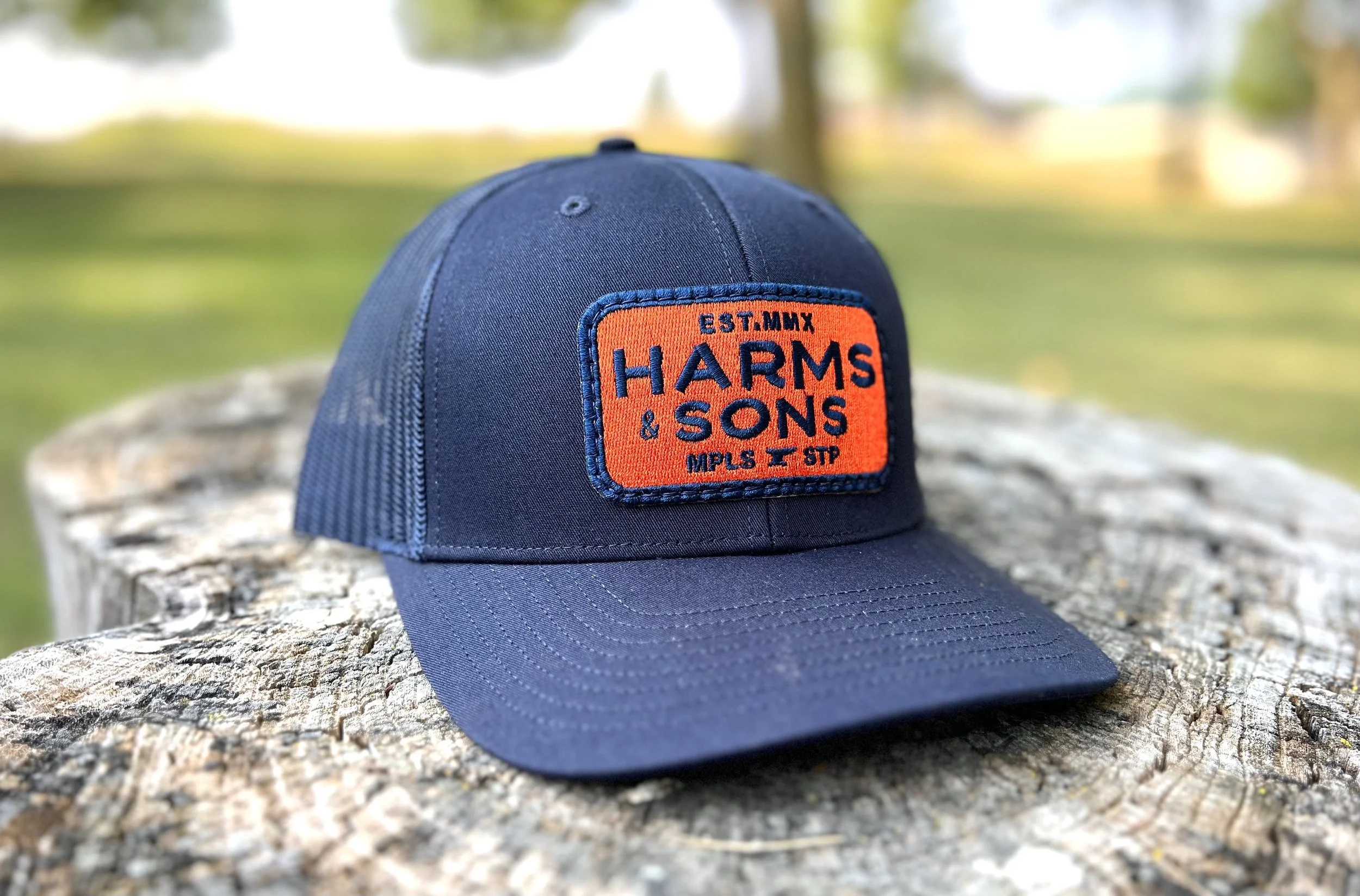 Trucker Snapback Cap - Navy / Orange patch — Harms and Sons